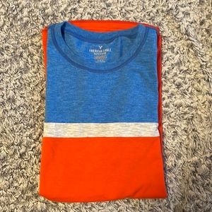 Size medium men’s blue orange and gray short sleeve shirt active flex